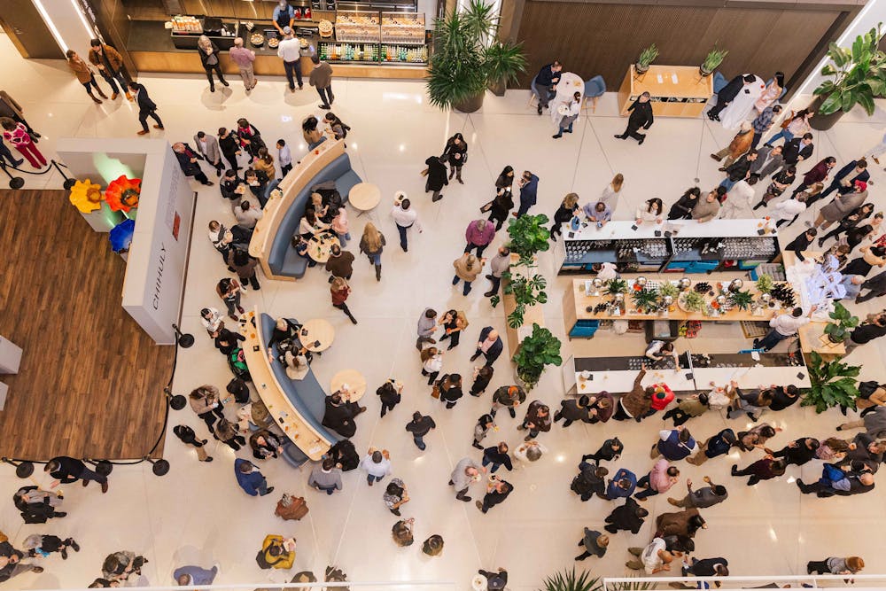 a room filled with furniture and a blue curtain