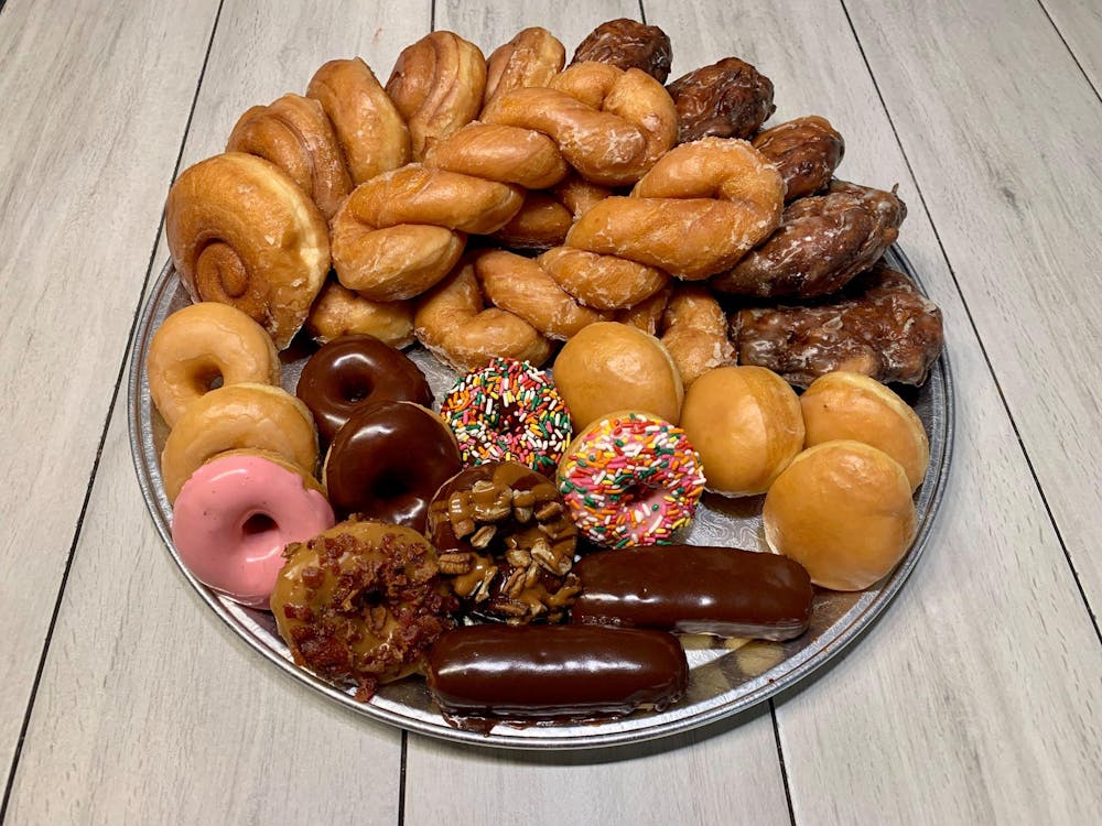 a donut sitting on top of a wooden table