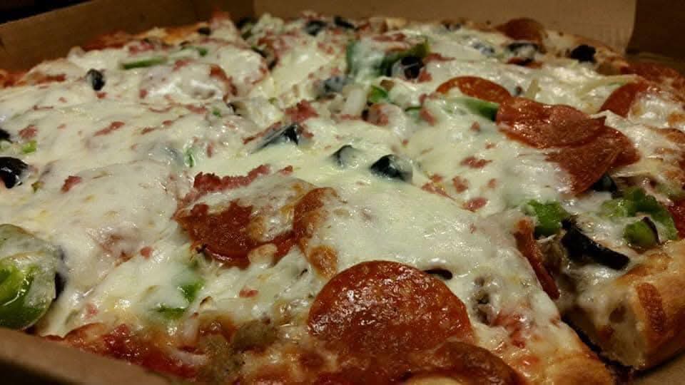 a close up of a slice of pizza