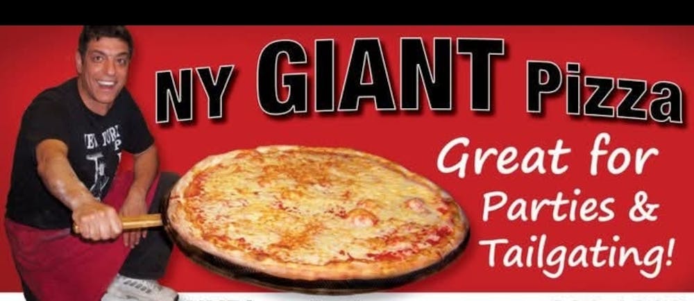 a person holding a pizza