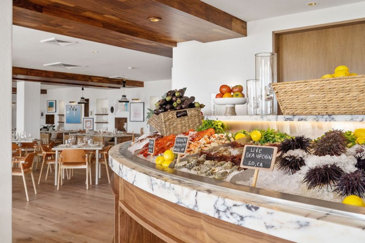 a kitchen filled with lots of food on a table