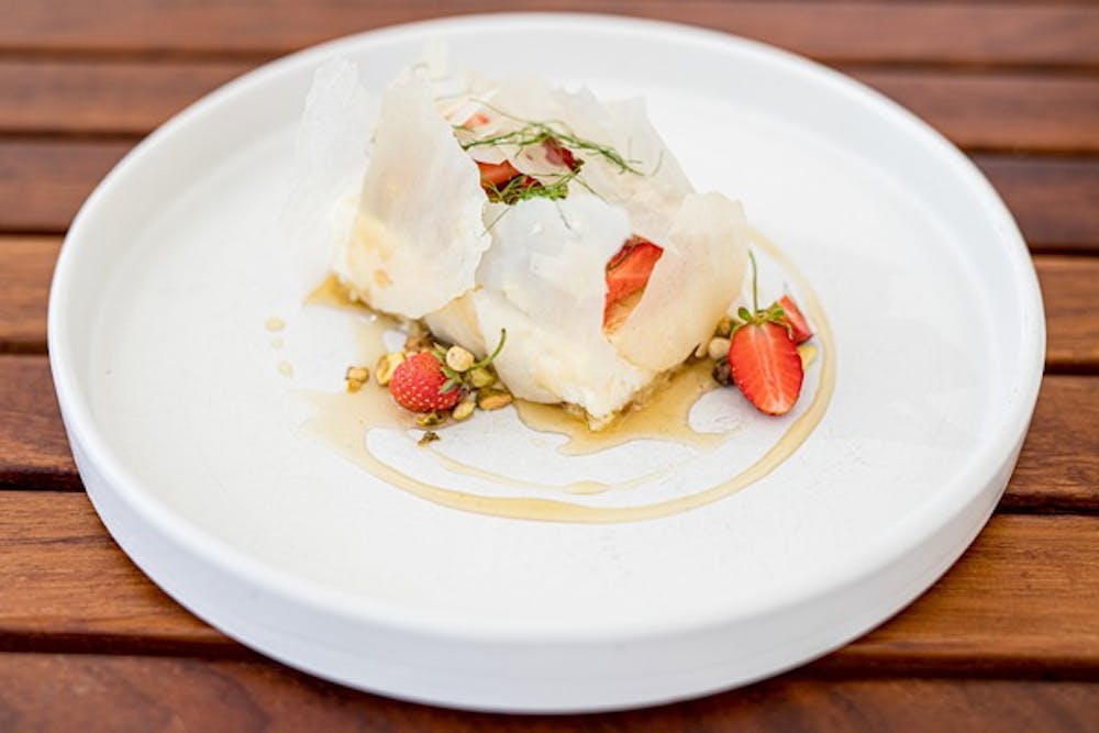 a plate of food on a wooden table