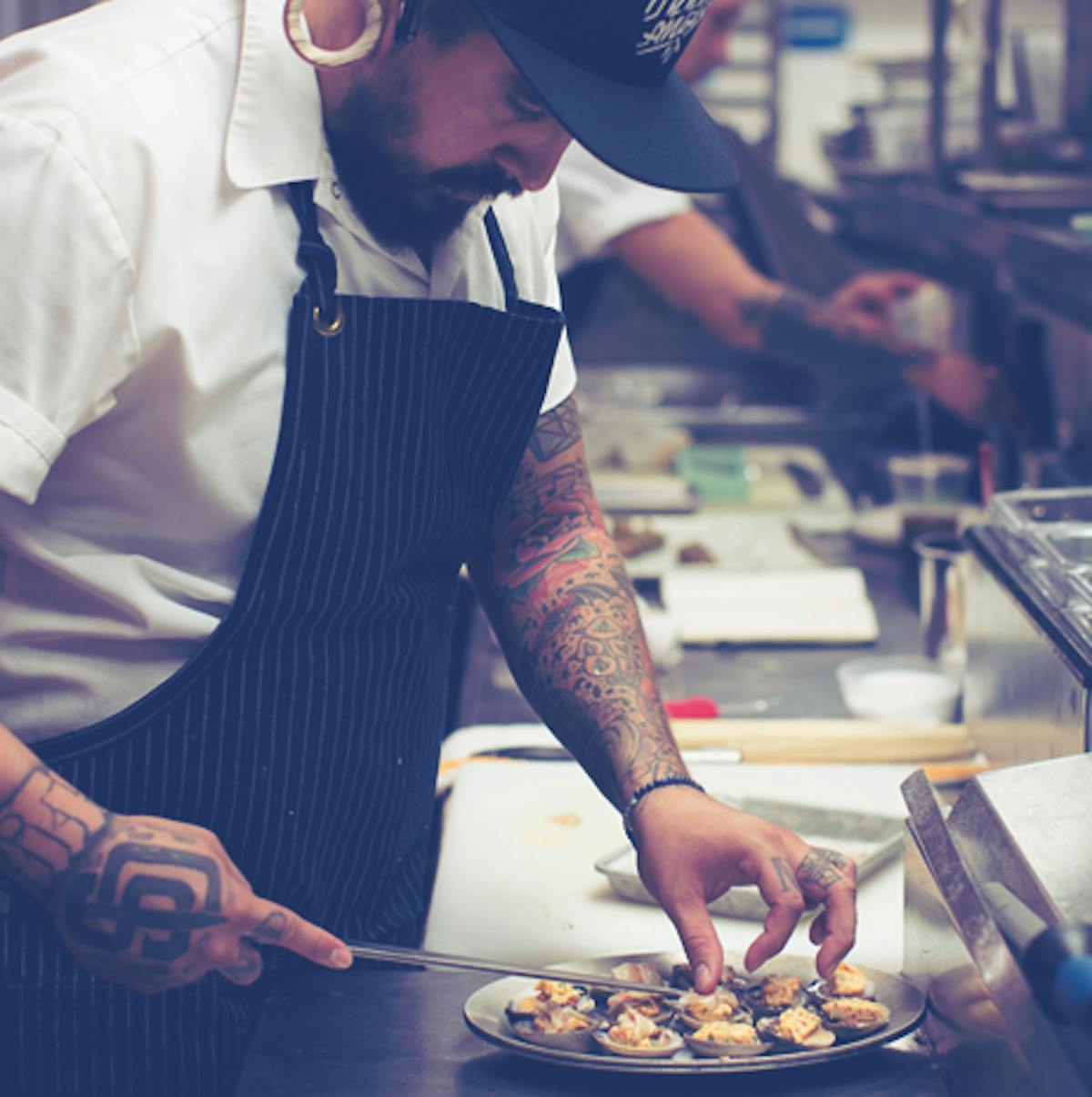 a man cooking food on a table