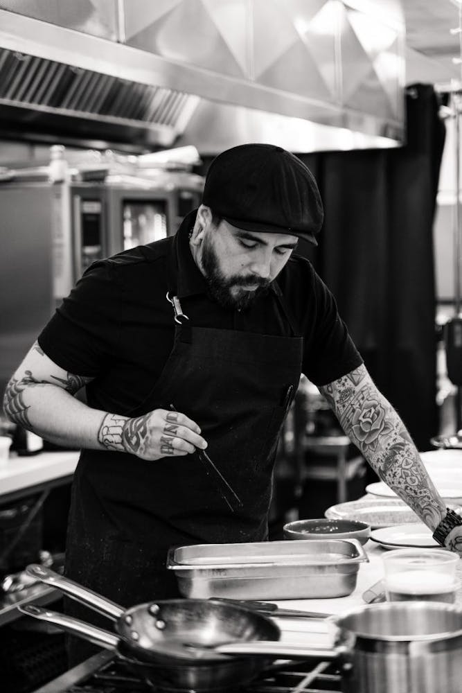 a person cooking in a kitchen preparing food