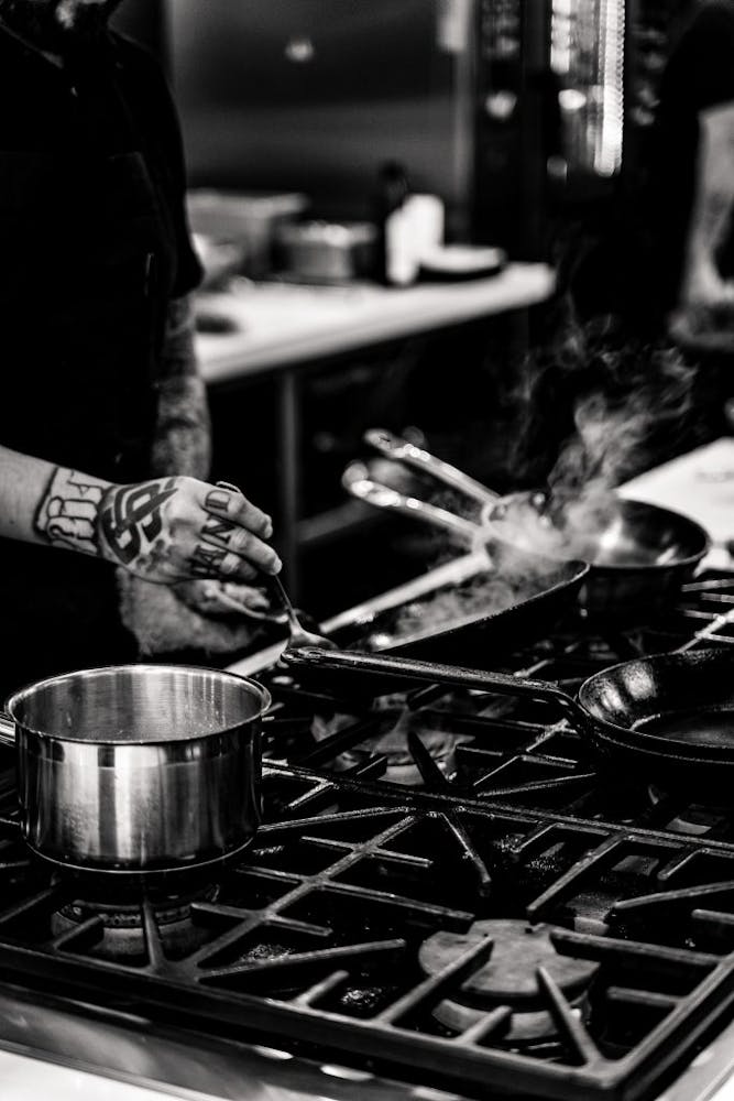 a person cooking food in a pan