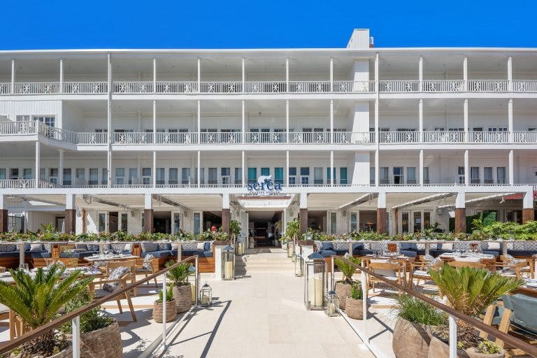 a group of people in front of a building