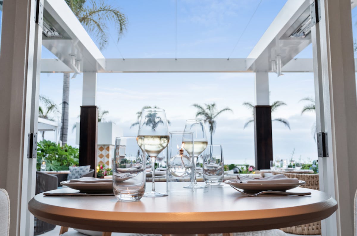 a dining room table in front of a window