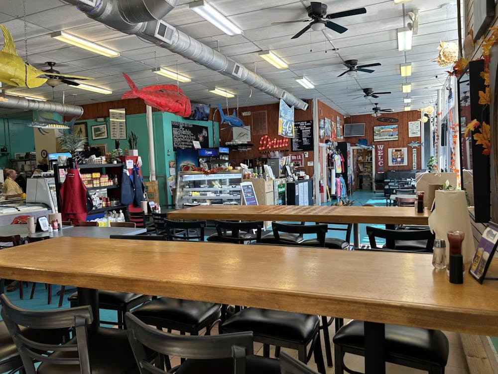 a group of people sitting at a table in a restaurant