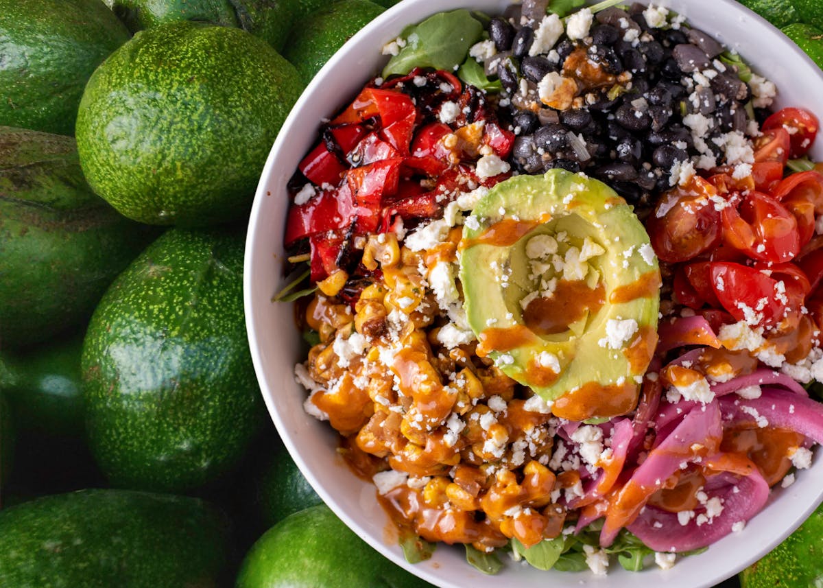 a bowl filled with different types of food on a plate