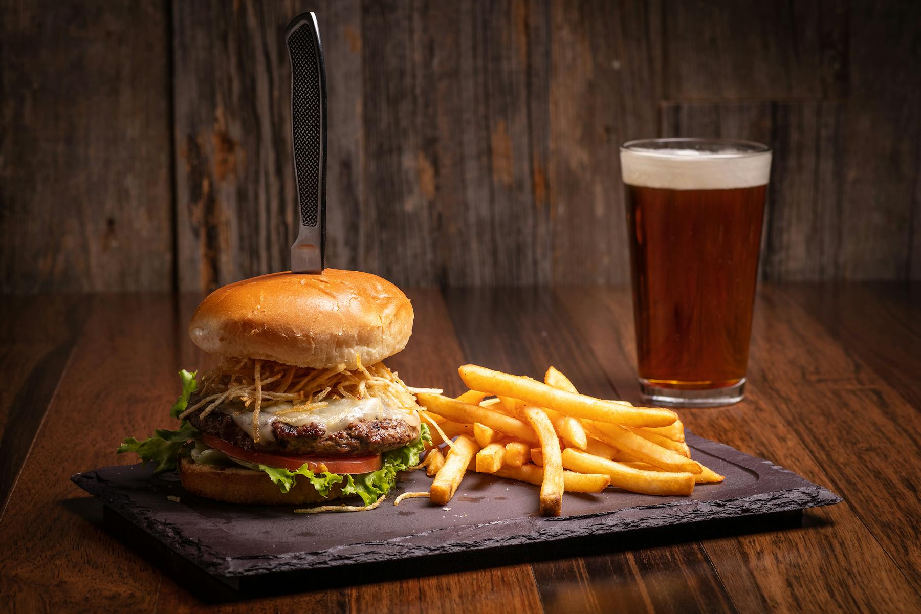 a sandwich sitting on top of a wooden cutting board