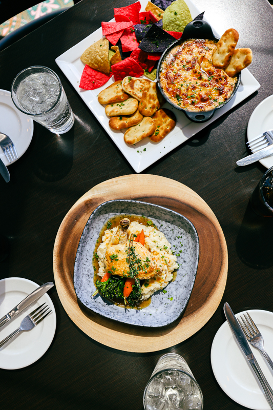Overhead picture of chicken dish and crab dip