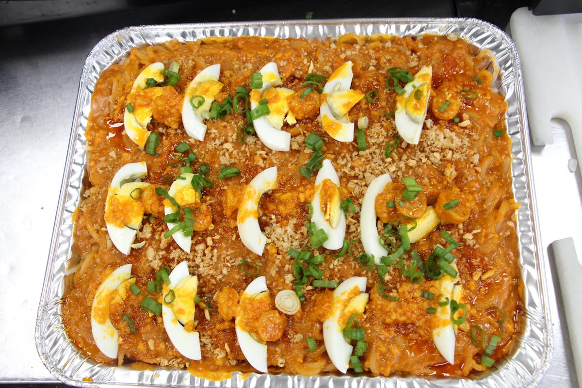 a plate of food with a slice of pizza