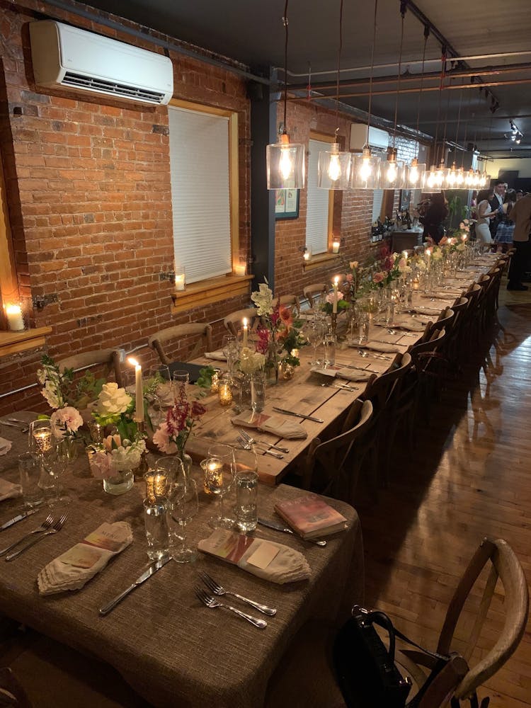 a group of people sitting at a table with wine glasses