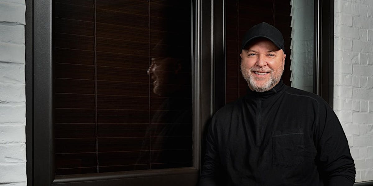 Wilo Benet standing in front of a window
