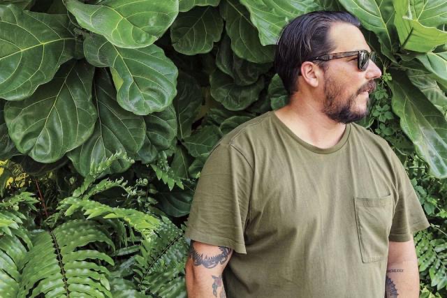 a man in a green shirt