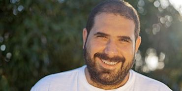 a man smiling for the camera