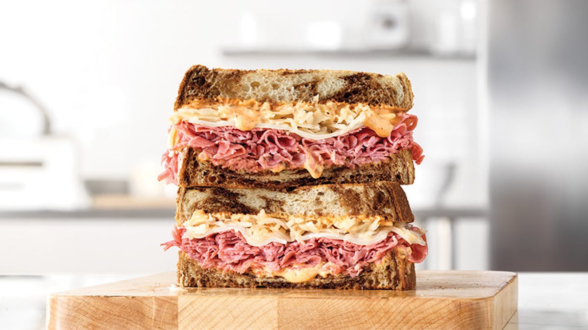 a photo of (possibly) roast beef or corned beef sandwiches