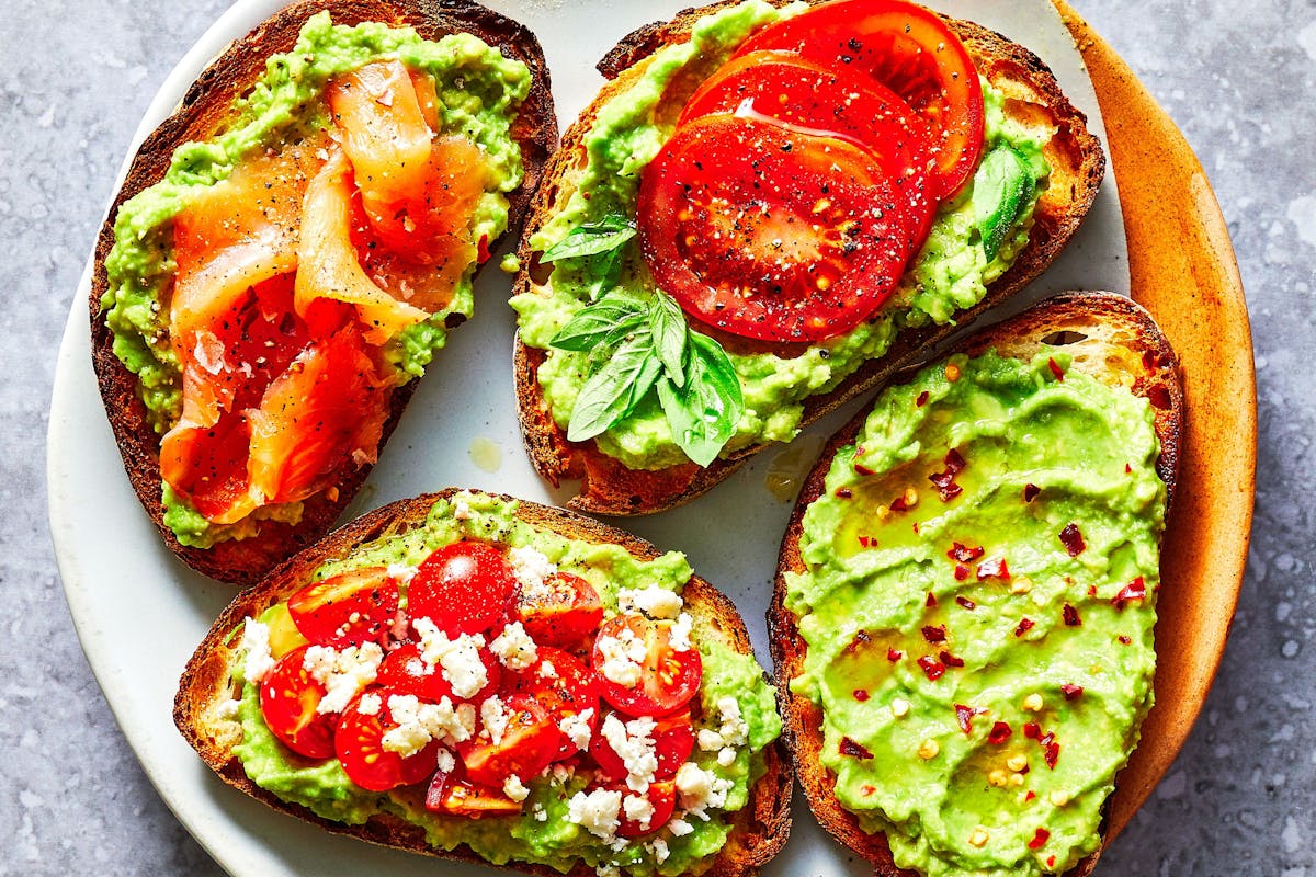 a close up of various avocado toasts