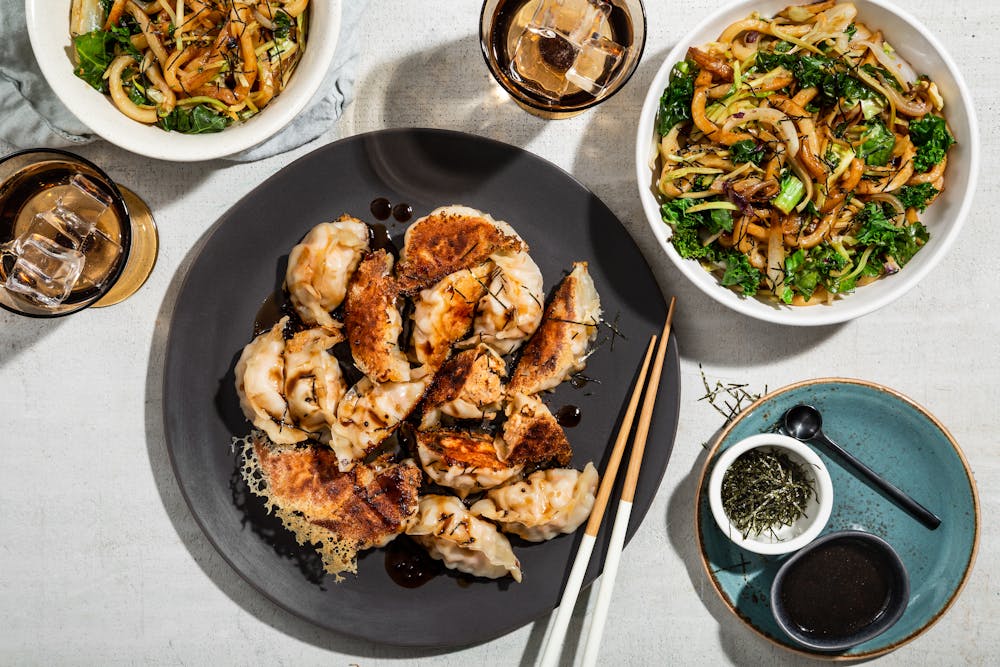 a bunch of food sitting on top of a wooden cutting board