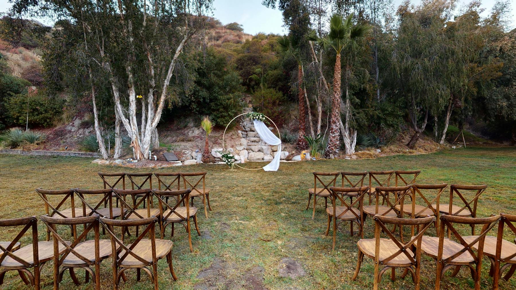 a picnic table in front of a fence