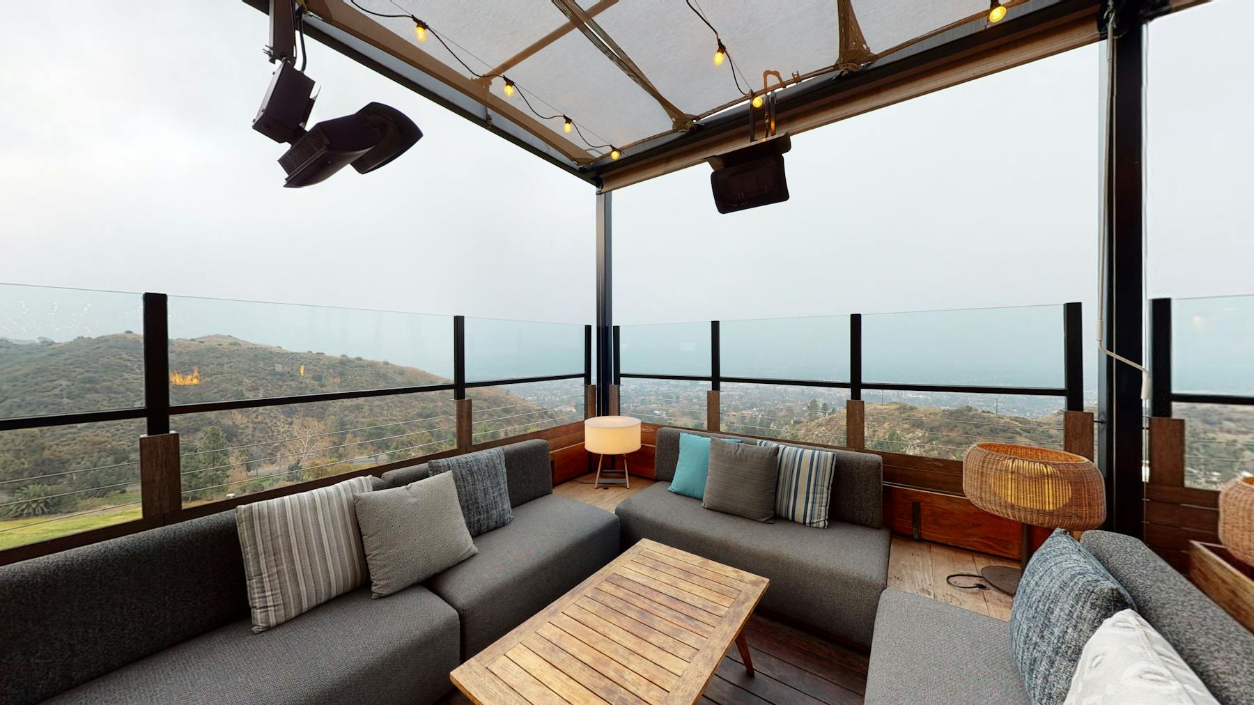 a view of a living room with a bridge in the background