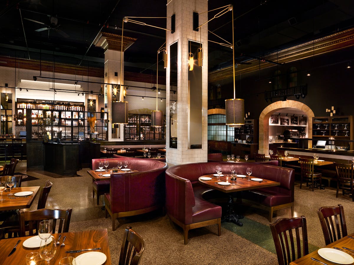 a kitchen with a table in a restaurant