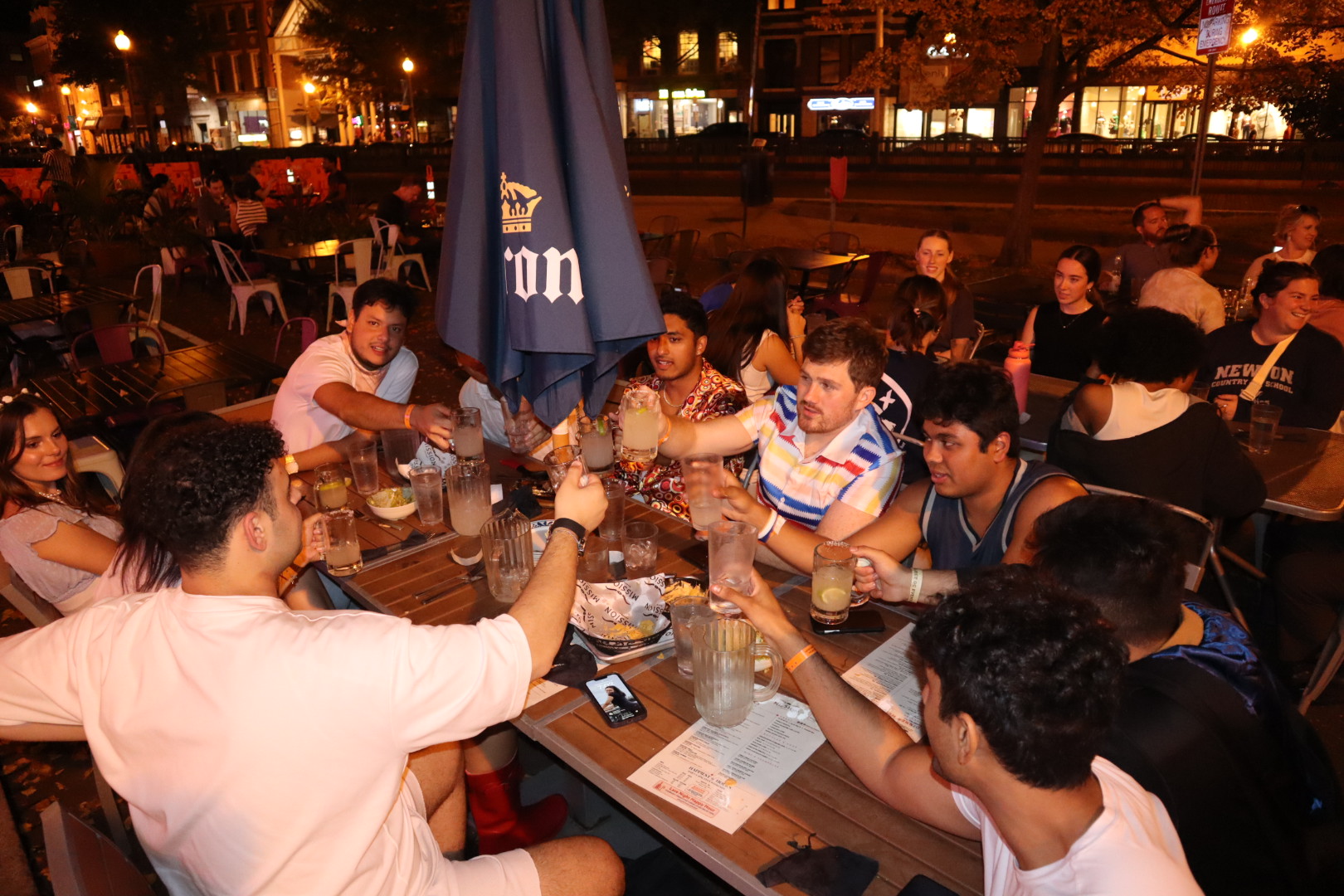 a group of people sitting at a table in front of a crowd