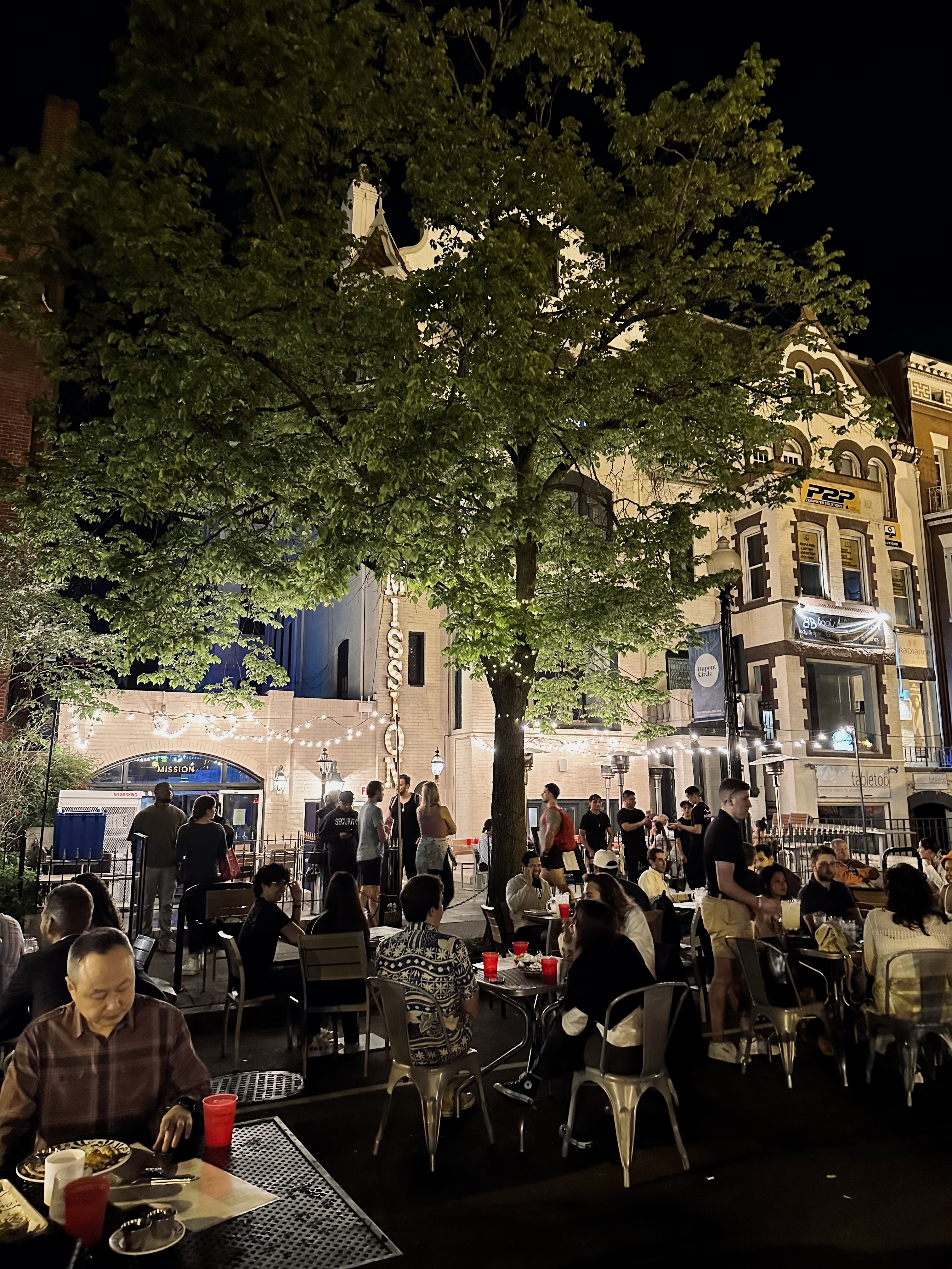 a group of people standing in front of a building