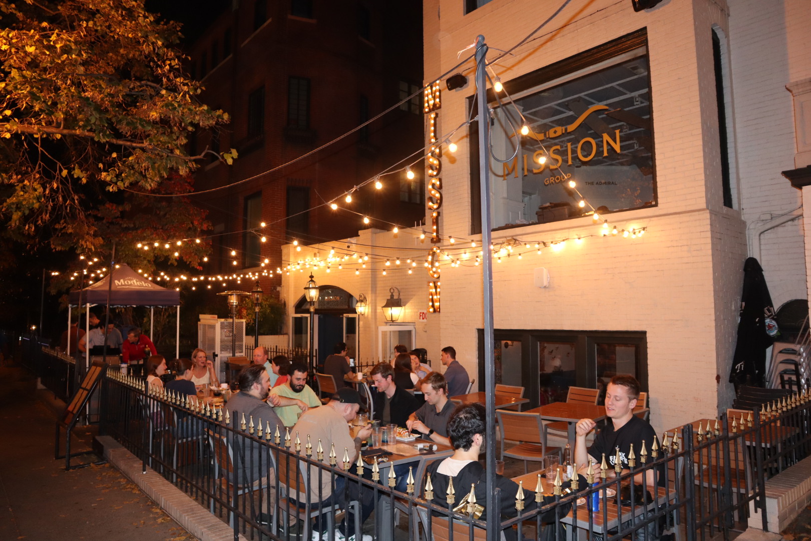 a group of people standing in front of a building