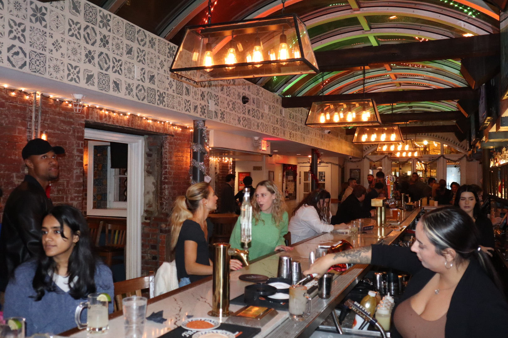 a group of people sitting at a table in a restaurant