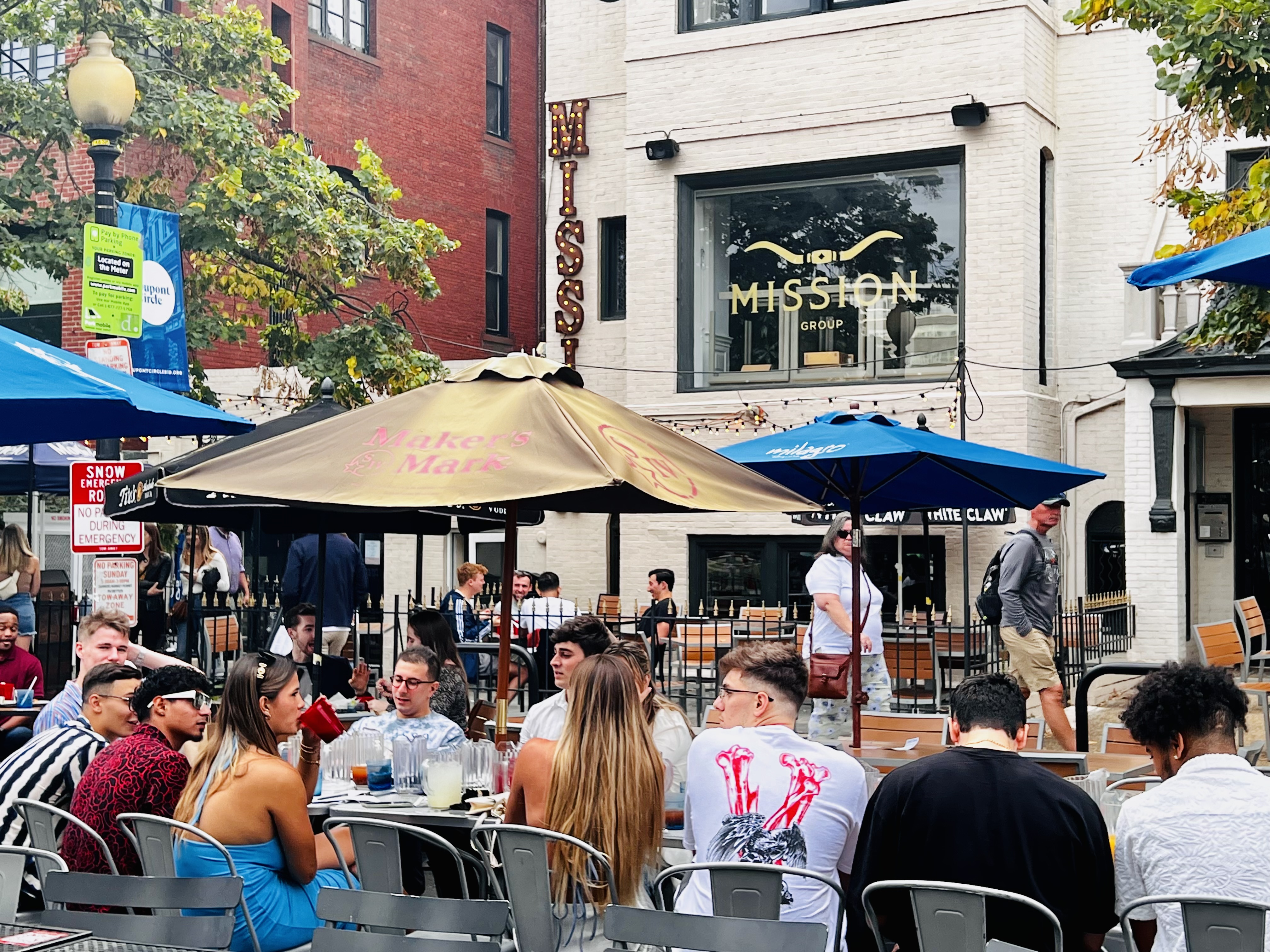 a group of people walking down a street