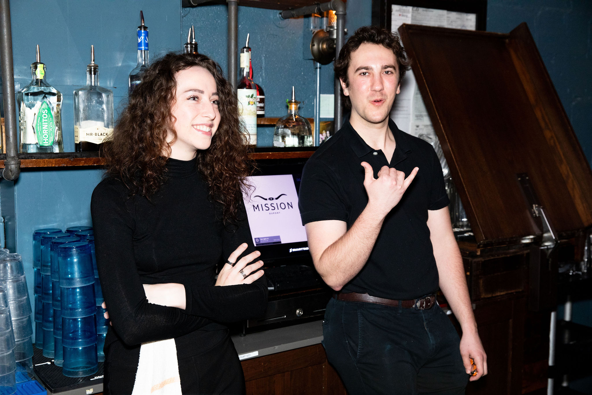 a man and a woman sitting on a table