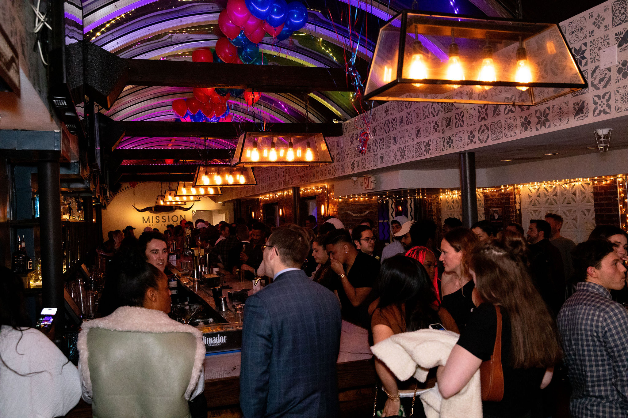 a group of people standing in front of a crowd