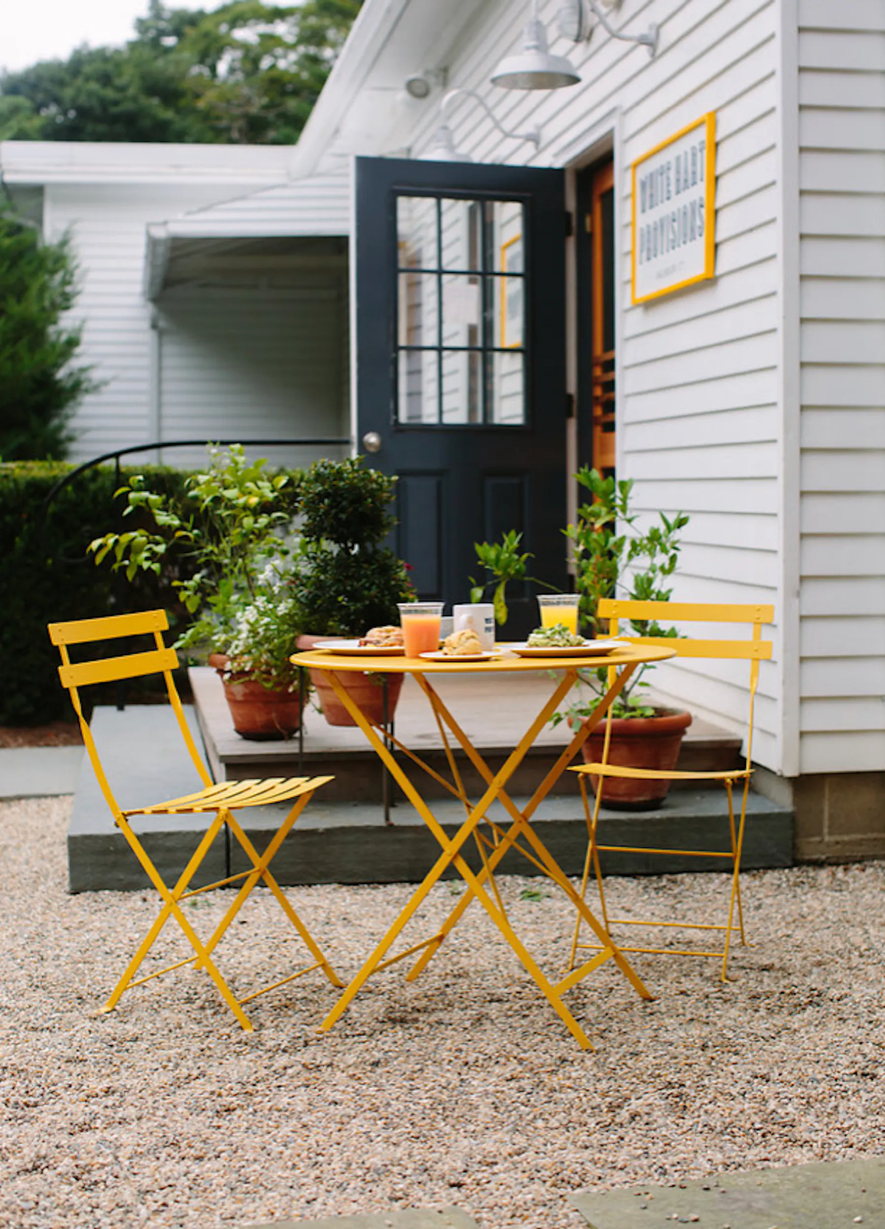 a chair sitting in front of a house