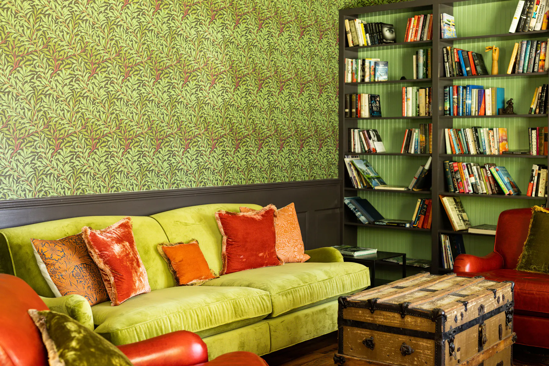 a living room with a book shelf
