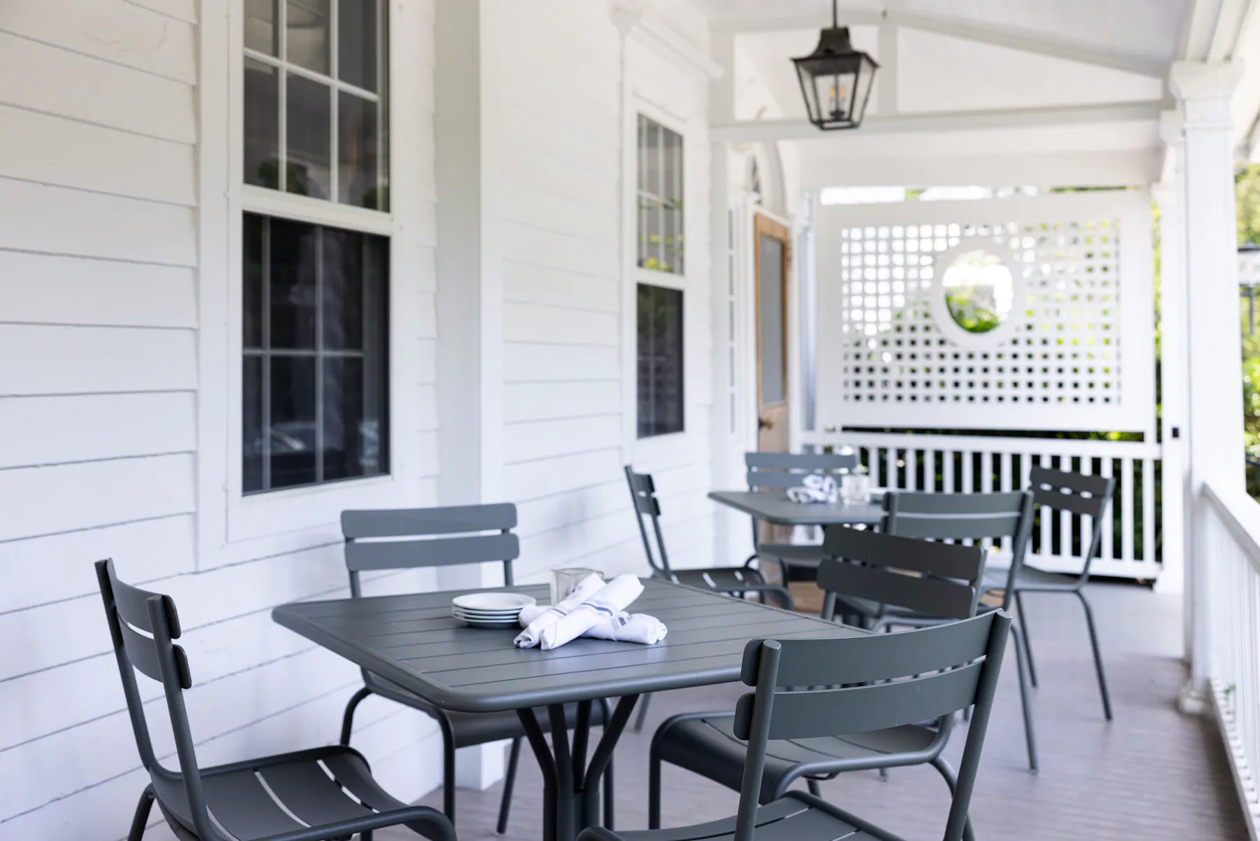 a dining room table in front of a window