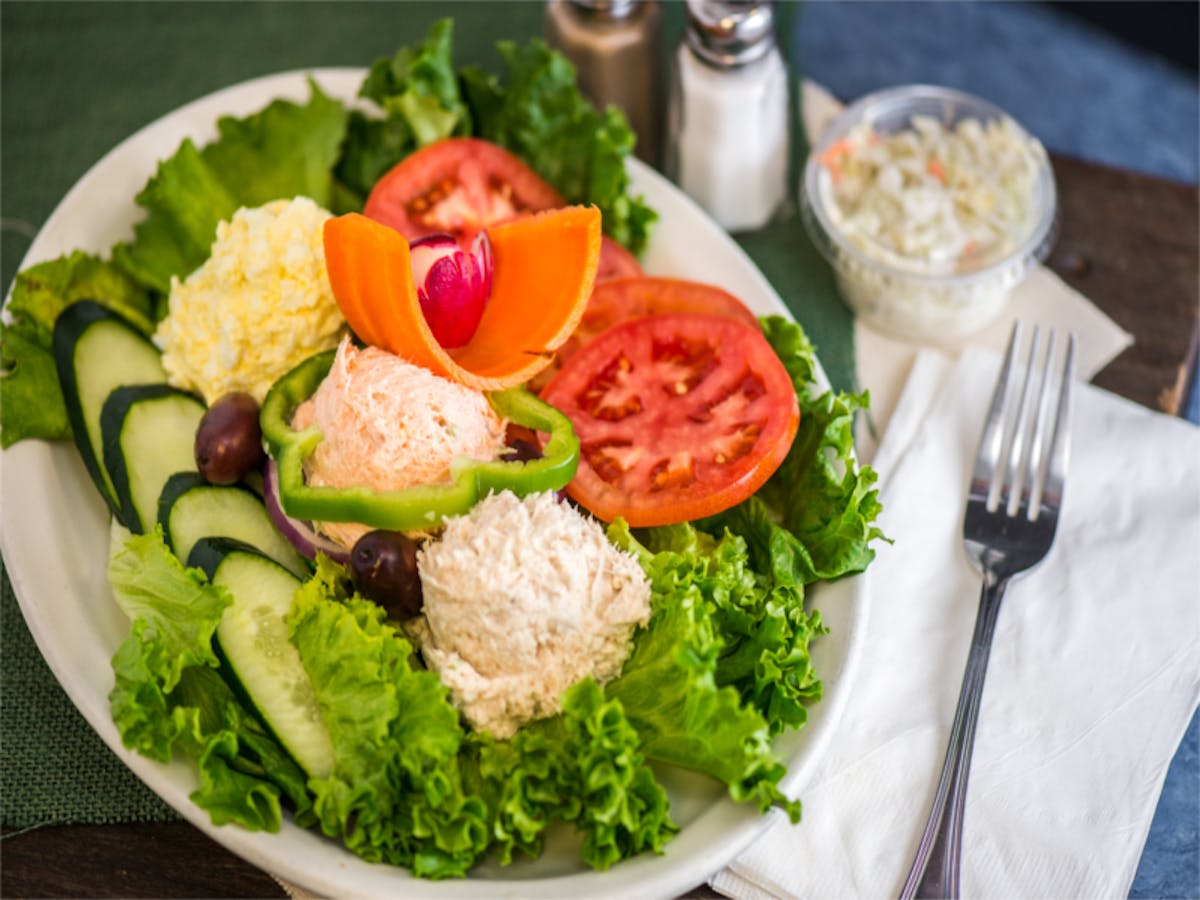 a bowl of salad on a plate