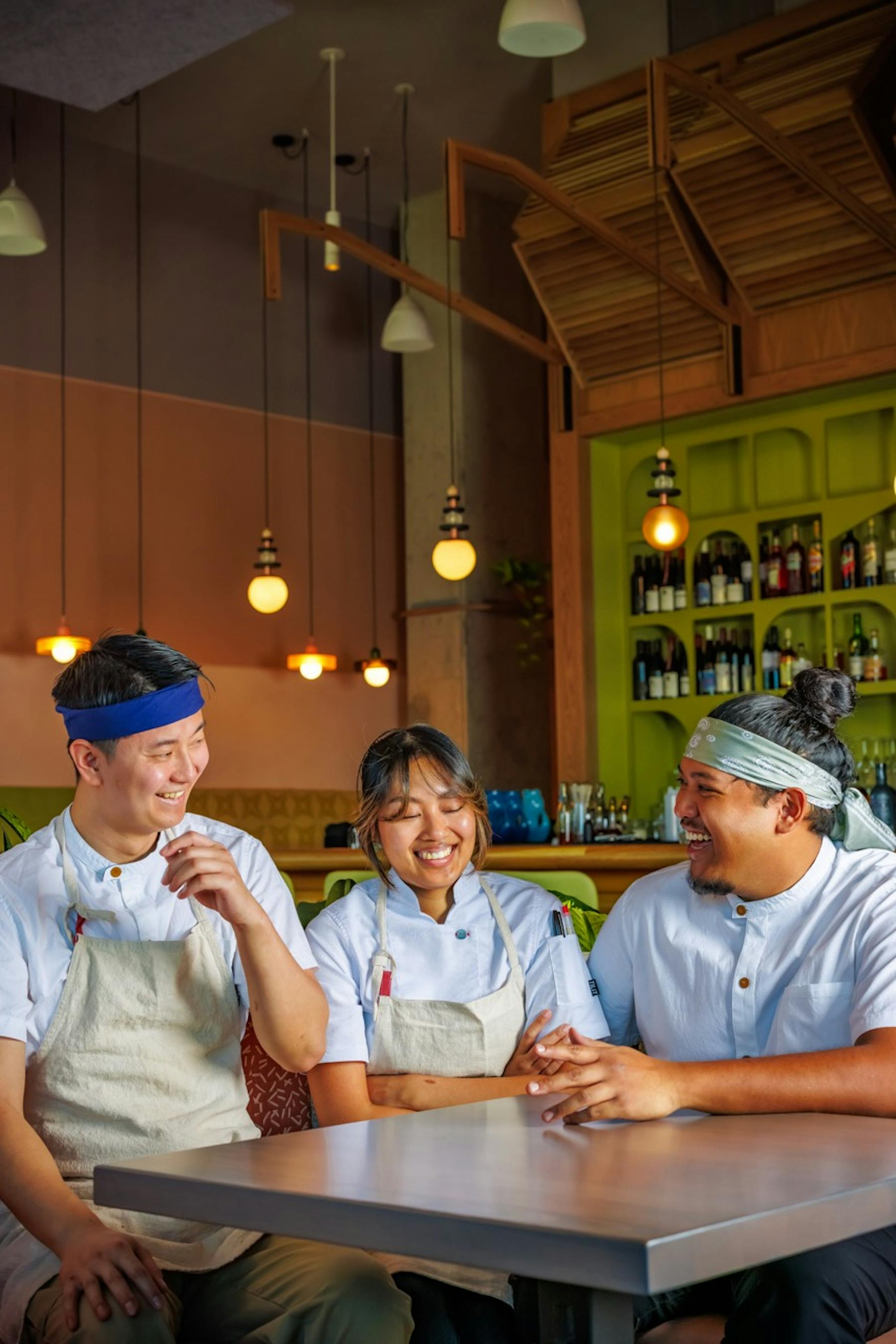 a group of people sitting at a table