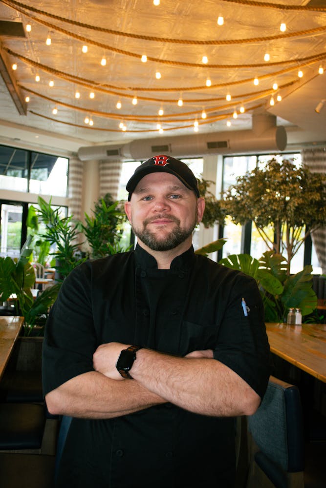 a man standing in front of a table