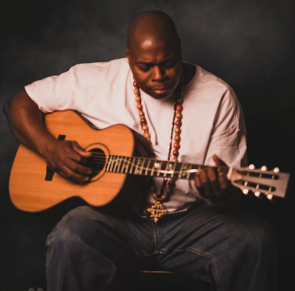 a man holding a guitar