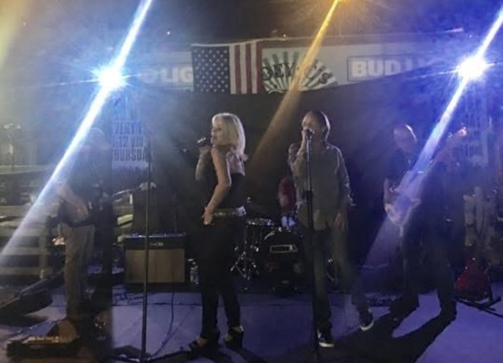 a group of people standing on a stage