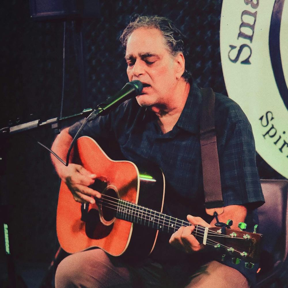 a man holding a guitar