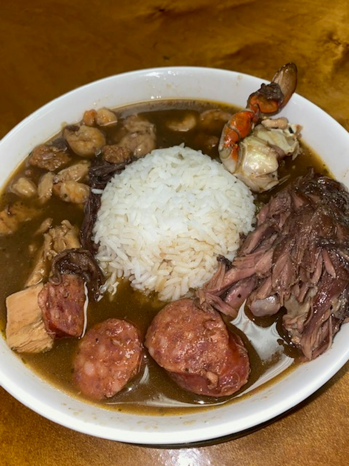 a plate of food with rice meat and vegetables