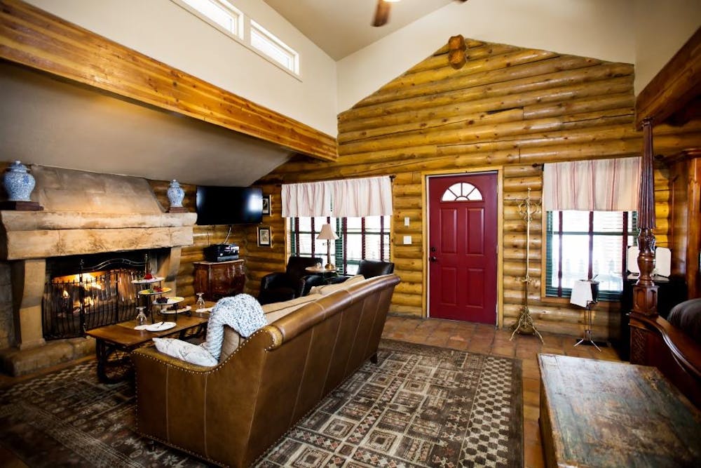 a living room filled with furniture and a large window