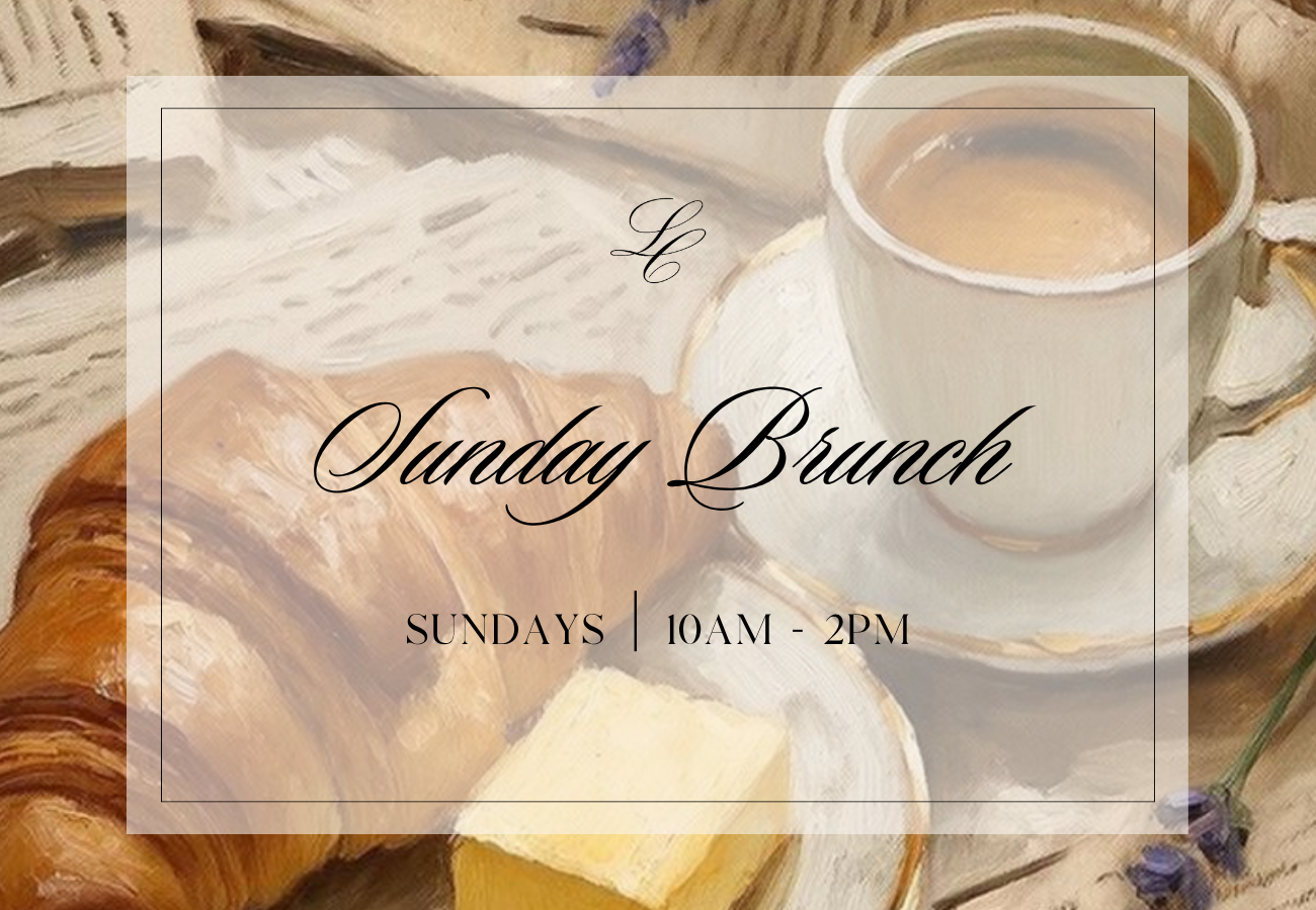 a breakfast with a cup of coffee and a croissant