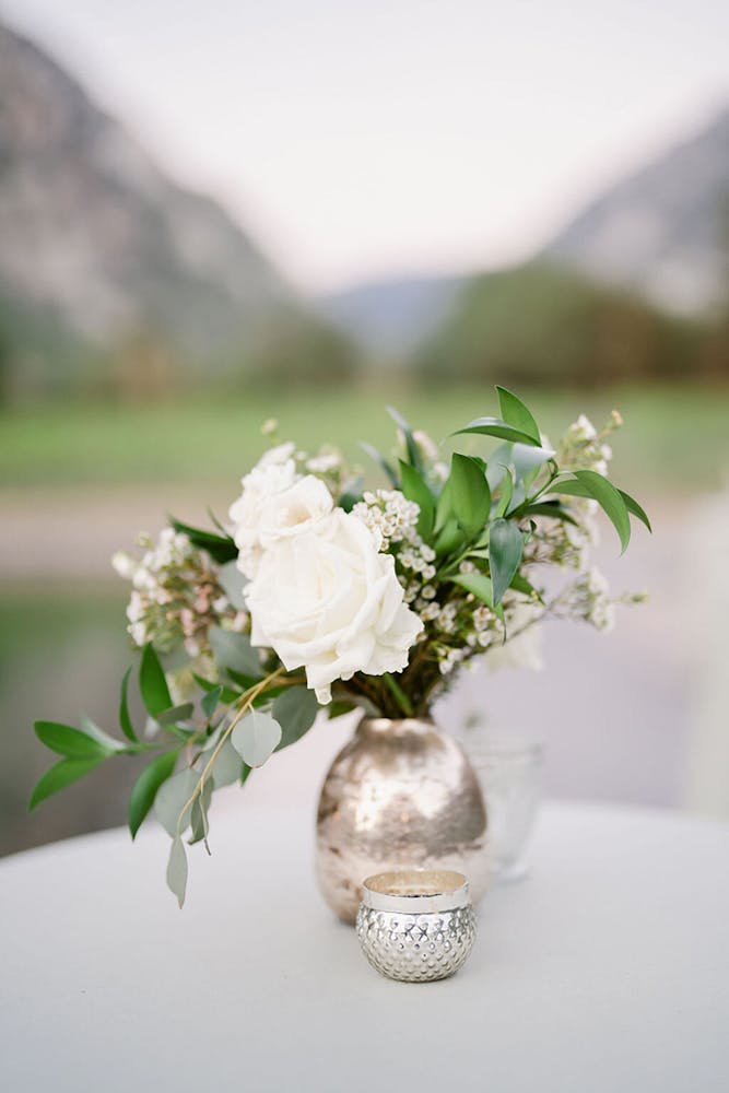 a bouquet of flowers in a vase on a table