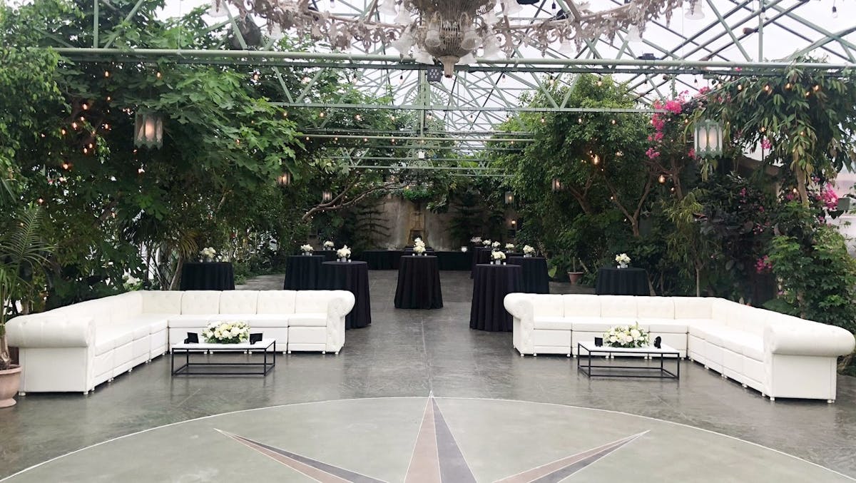 a group of people standing in front of a building