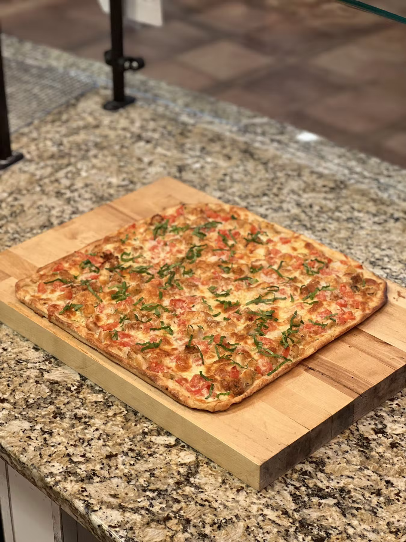 a pizza sitting on top of a wooden box
