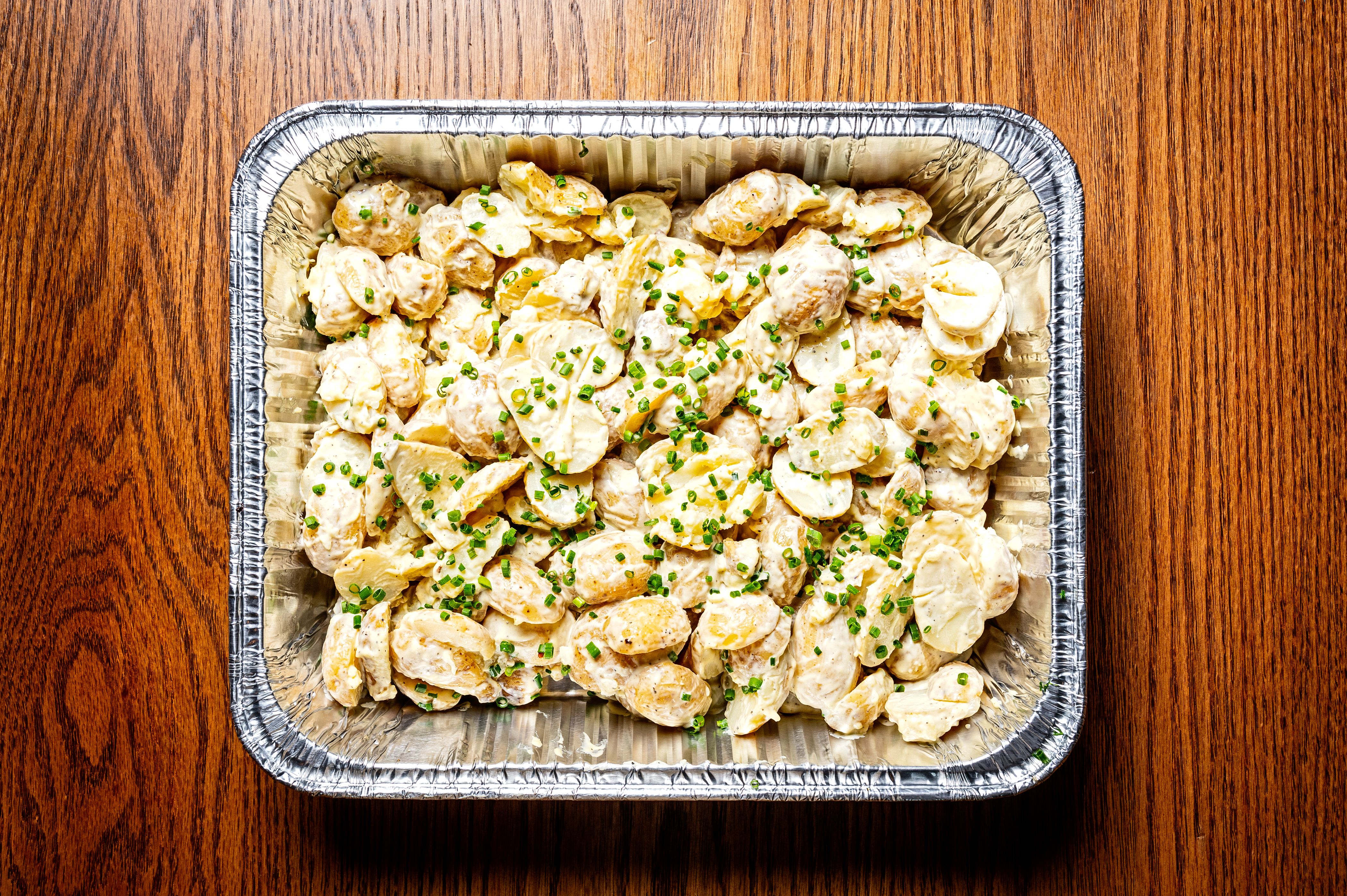 a bowl of food sitting on top of a wooden table