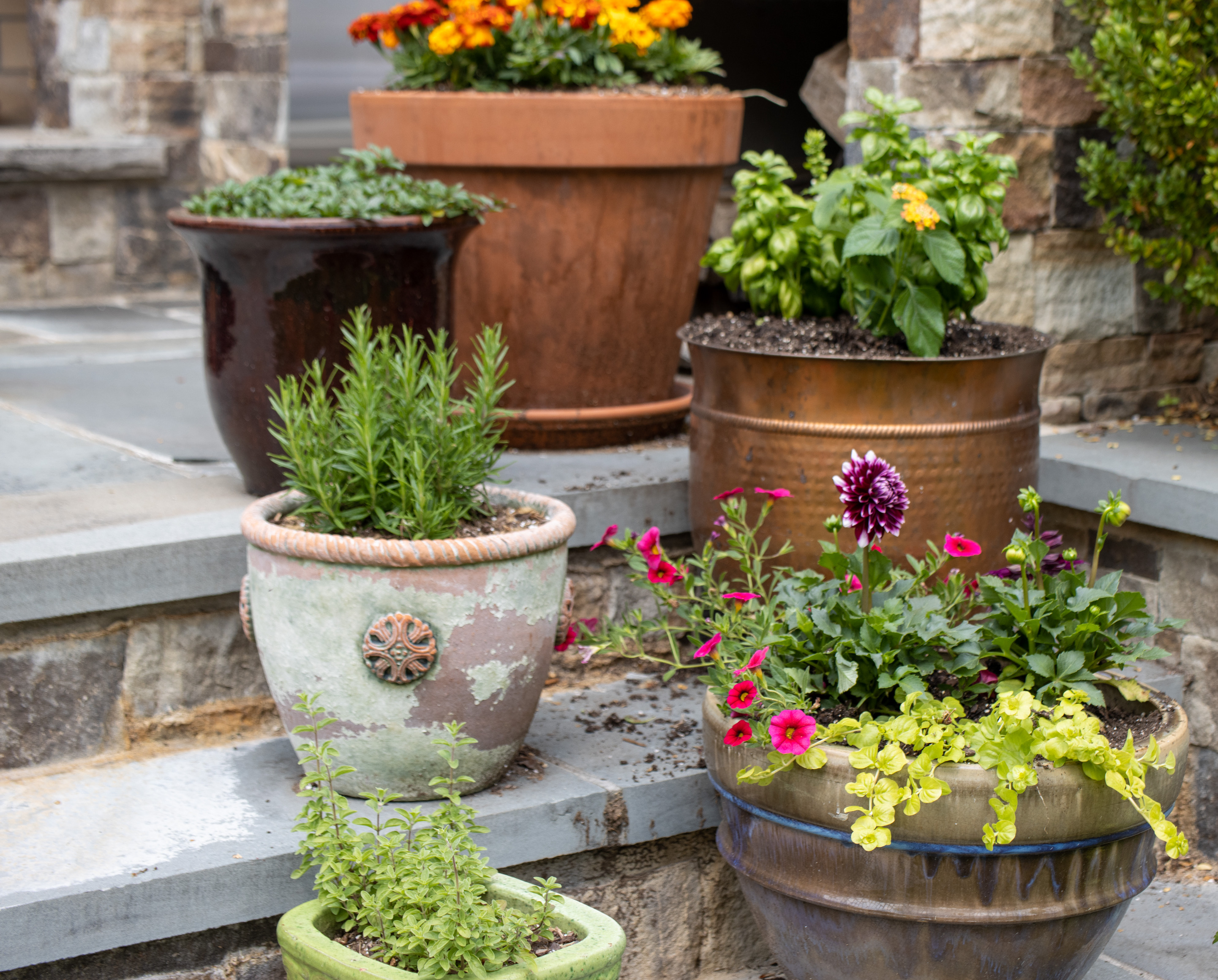 a flower pot that is sitting on the side of a building